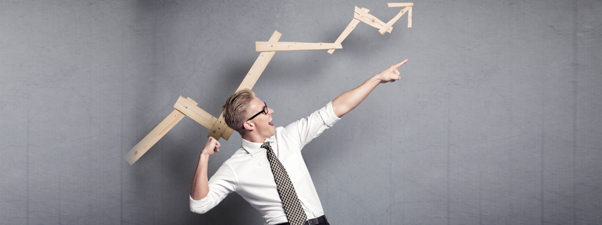 man pointing up in direction of an arrow